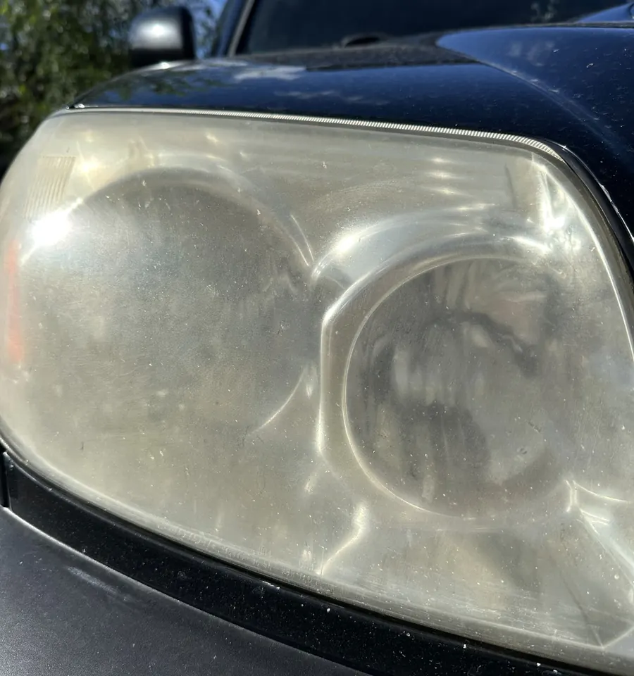 Oxidized, yellowed headlight lens before restoration